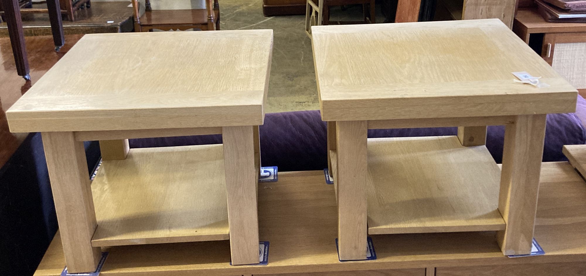A pair of contemporary oak two-tier occasional tables, width 55cm, depth 55cm, height 45cm